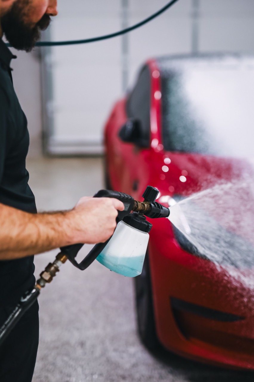 A car getting a foam bath and hand wash